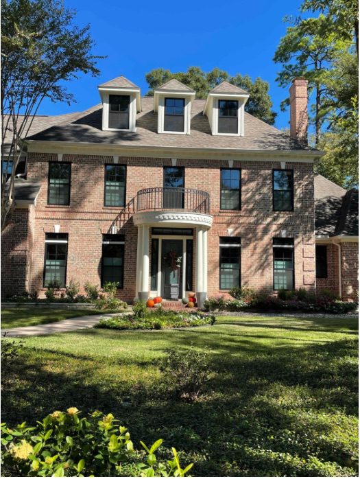 Black Andersen 100 Series windows installed in a Waterford Bend home exterior.